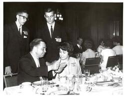 ["Black and white photograph of Carl Albert with representatives from the Oklahoma Gas and Electric Company."]