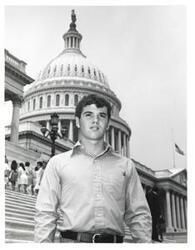 ["Black and white photograph of David Argo of McAlester, Oklahoma in front of Capitol building."]