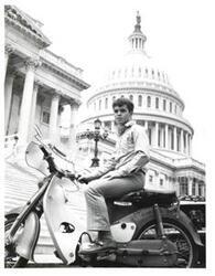 ["Black and white photograph of David Argo of McAlester, Oklahoma in front of Capitol building."]