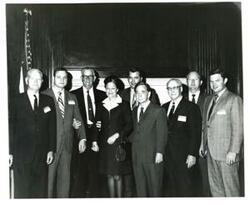 ["Black and white photograph of Carl Albert with Page Belcher and members of the President's Committee on Employment of the Handicapped."]
