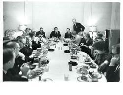 ["Black and white photograph of Carl Albert at a luncheon."]