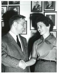 ["Black and white photograph of Carl Albert with a woman."]