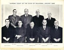 ["Black and white photograph of Justices of the Oklahoma Supreme Court. From left: Wayne W. Bayless, Ben Arnold, Denver N. Dawson, N. S. Corn, Thurman S. Hurst, Thomas L. Gibson, Fletcher S. Riley, John E. Luttrell, and Earl Welch. January 1948"]