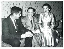 ["Black and white photograph of Carl Albert with a couple."]