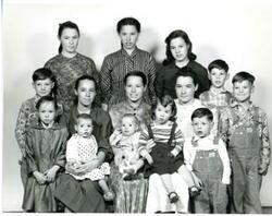 ["Black and white photograph of family portrait. Last name unknown. First names on back of photo. December 19, 1959"]