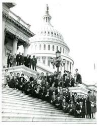["Black and white photograph of Group on Capitol steps."]