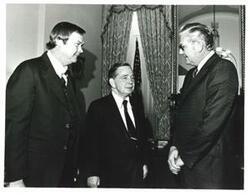 ["Black and white photograph of Carl Albert with Jim Beach and Jim Hall. January 15, 1975"]