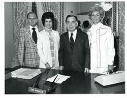 ["Black and white photograph of Carl Albert, Jack Ellison, and two women."]