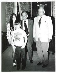 ["Black and white photograph of Carl Albert with Charles Goodman and his niece and nephew. June 16, 1975"]