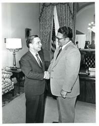 ["Black and white photograph of Carl Albert with Frank Harbin, mayor of McAlester, Oklahoma. July 1974"]
