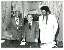 ["Black and white photograph of Carl Albert with Mayor Jones of Tatum, Oklahoma and Windell Simpson. December 1975"]