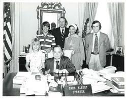 ["Black and white photograph of Carl Albert with the family of Robert S. Kerr, Jr. April 25, 1975"]