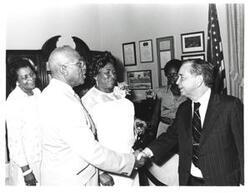 ["Black and white photograph of Carl Albert with members of an Oklahoma City Baptist church. August 1976"]
