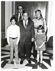 ["Black and white photograph of Carl Albert with the Dr. Michael Vinci family. 1974"]