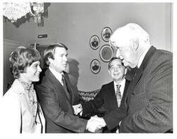 ["Black and white photograph of Carl Albert, Thomas P. O'Neill, Wes Watkins, and an unidentified woman. September 1976"]
