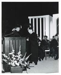 ["Black and white photograph of Carl Albert receiving Distinguished Service Citation, at the University of Oklahoma, from George Lynn Cross. May 1962."]