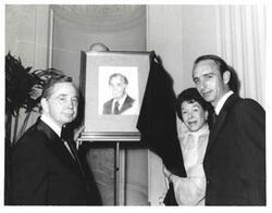 ["Black and white photograph of Carl Albert and Mary Albert with guests at the American Revolution Bicentennial Ball in Oklahoma. A portrait sketch of Carl Albert has been unveiled. October 2, 1976"]