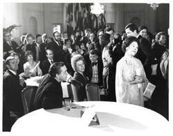 ["Black and white photograph of Mary Albert being recognized at the American Revolution Bicentennial Ball in Oklahoma. October 2, 1976. Also present: Dewey Bartlett and George Nigh."]