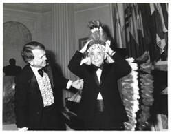 ["Black and white photograph of Carl Albert with his Indian headdress at the American Revolution Bicentennial Ball in Oklahoma. October 2, 1976"]