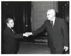 ["Black and white photograph of Carl Albert shaking hands with a man at the American Revolution Bicentennial Ball in Oklahoma. October 2, 1976"]