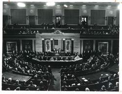 ["Black and white photograph of  Gerald R. Ford speaking at a joint session of Congress. Carl Albert and James O. Eastland also shown. October 8, 1974"]