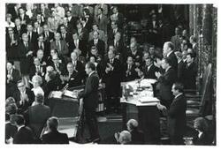 ["Black and white photograph of  Richard M. Nixon, Gerald R. Ford and Carl Albert shown in the House chambers. December 6, 1973"]