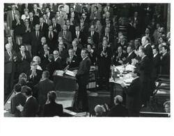 ["Black and white photograph of  Richard M. Nixon, Gerald R. Ford and Carl Albert shown in the House chambers. December 6, 1973"]