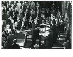 ["Black and white photograph of  Richard M. Nixon, Gerald R. Ford and Carl Albert shown in the House chambers. December 6, 1973"]