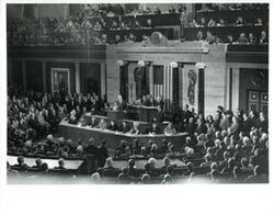 ["Black and white photograph of  Gerald R. Ford addressing Congress. Carl Albert, James O. Eastland, Richard Nixon are shown. December 6, 1973"]