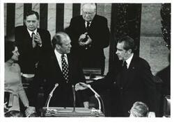 ["Black and white photograph of  Gerald R. Ford after being sworn into office. From left: Betty Ford, Carl Albert, Gerald R. Ford, James O. Eastland, and Richard M. Nixon. December 6, 1973"]