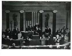 ["Black and white photograph of  Gerald R. Ford after being sworn into office. From left: Betty Ford, Carl Albert, Gerald R. Ford, James O. Eastland, and Richard M. Nixon. December 6, 1973"]