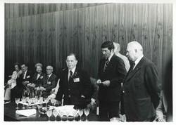 ["Black and white photograph print of Carl Albert, Melvin Price, Clement Zablocki, and others seated in a room during the House delegation trip to USSR, Romania, and Yugoslavia. August 1975"]