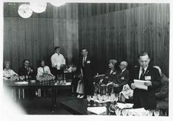 ["Black and white photograph print of Carl Albert, Clement Zablocki, Melvin Price, and others seated in a room. House delegation trip. August 1975"]