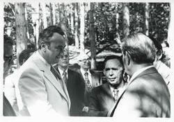 ["Black and white photograph print of Carl Albert, Leonid Brezhnev, Phillip Burton, and others standing outside in Yalta. House delegation trip. August 1975"]