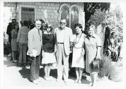 ["Black and white photograph print of group of people posing for a picture during the House delegation trip. August 1975"]