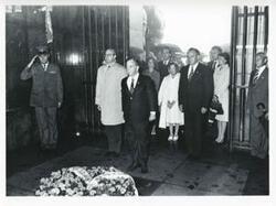 ["Black and white photograph print of Carl Albert and Mary Albert standing with several others during the House delegation trip. August 1975"]