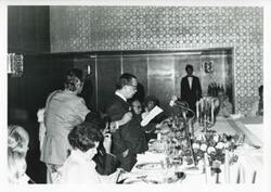 ["Black and white photograph print of  Carl Albert speaking to a group of people during the house delegation trip. August 1975"]