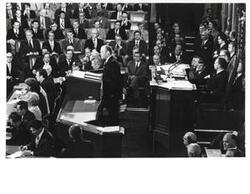 ["Gerald R. Ford's State of the Union message. Carl Albert and Nelson A. Rockefeller are seated behind Ford."]