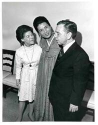 ["Carl Albert and Mary Albert shown with Mrs. Dong Jo Kim at a farewell party."]