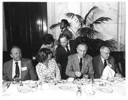 ["From left: Frank Moss, unidentified women, Carl Albert, Mike Mansfield, and James O. Eastland."]