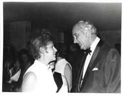 ["Lyndon B. Johnson talking to a woman."]