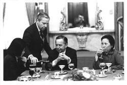 ["Carl Albert at a luncheon for a Chinese delegation. John Rhodes is pouring wine."]