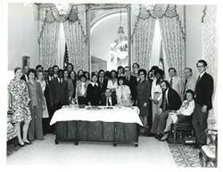 ["Carl Albert and office staff at a party."]