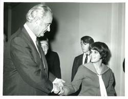 ["Lyndon B. Johnson shaking hands with a Carl Albert staff member."]