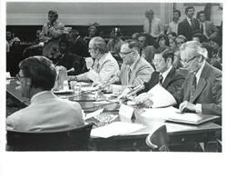 ["Walter Heller (right) at an economic conference with several other specialists. July 24, 1975"]