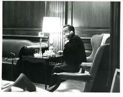 ["Carl Albert on the phone at the Roz Wyman luncheon."]