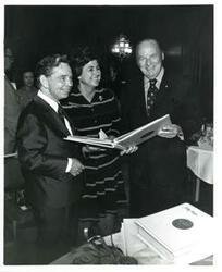 ["Carl Albert (left) and Roz Wyman at a luncheon."]