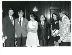 ["Carl Albert (third from left) with the Oklahoma REC group. Dewey F. Bartlett at right. Beverly Vogel second from right. June 1973"]