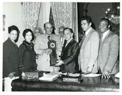 ["Carl Albert receives a clock from the Cuban Crusade. Cuban Independence Day. May 21, 1973"]