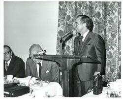 ["Carl Albert standing at the speaker's podium."]